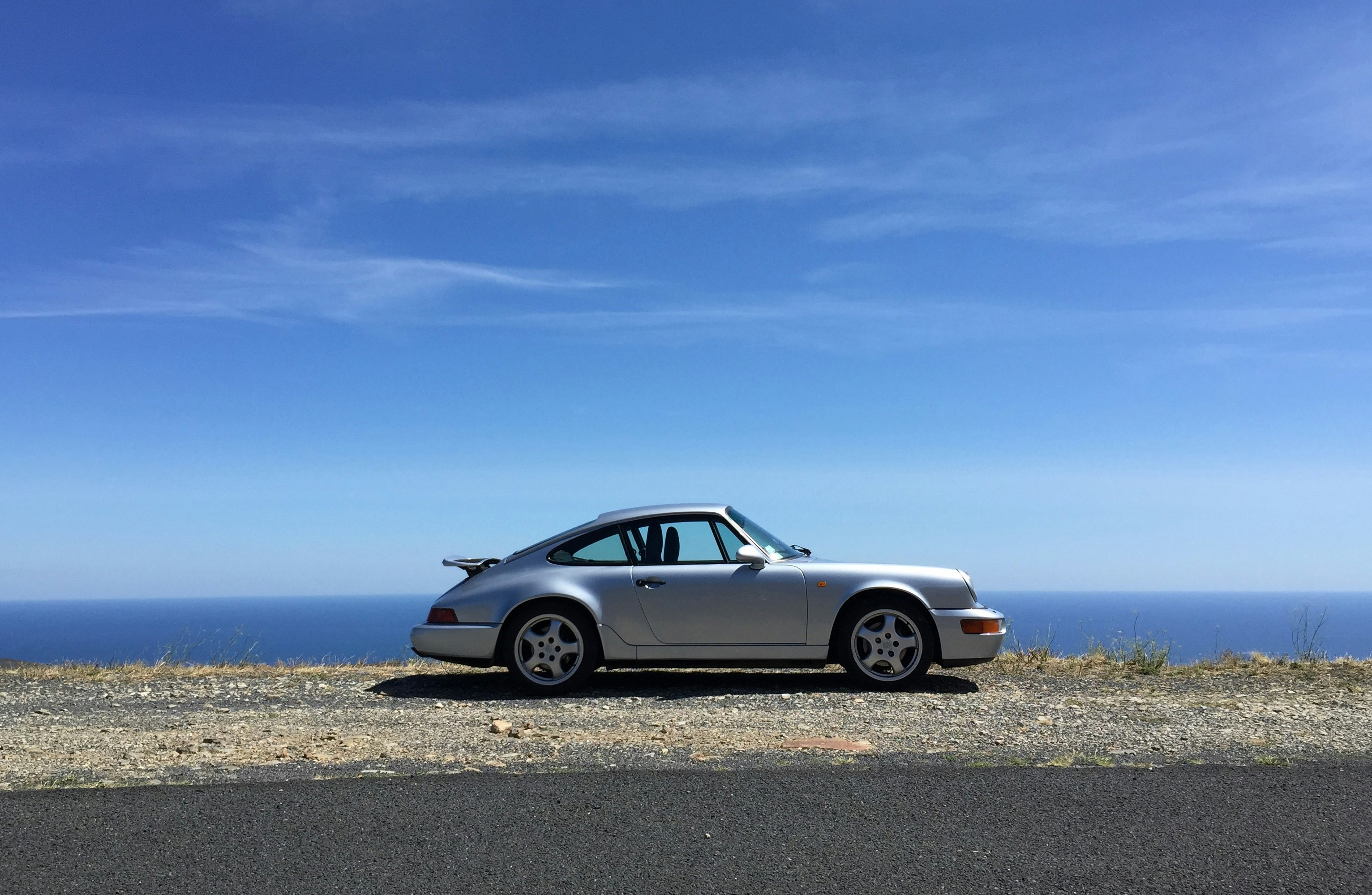Classic Porsche overlooking Mediterranean sea in Mallorca